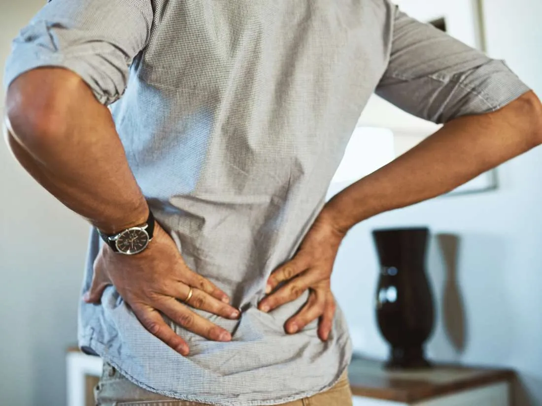What can cause back pain while breathing?